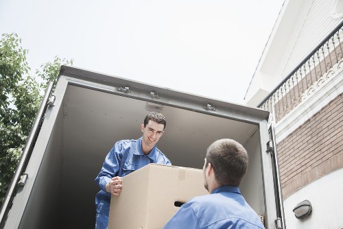 Van and helper navigating a Kingston residential street