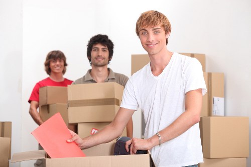 Local movers handling office furniture and IT equipment during a Kingston relocation