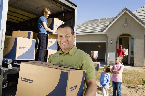 Packed boxes and furniture ready for a Kingston removal service